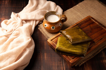 Oaxacan Tamales. Prehispanic dish typical of Mexico and some Latin American countries. Corn dough wrapped in banana leaves. The tamales are steamed.