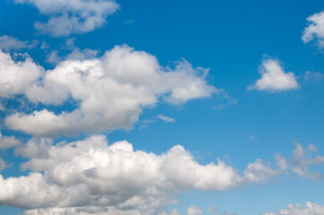 Naklejka na ściany i meble Beautiful white clouds with blue sky in the background 