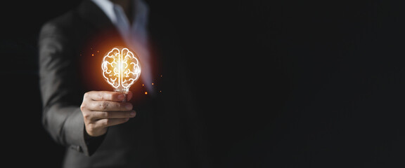 Businessman holding light bulb with brain icon inside, Futuristic businesss Ideas concept, Creative, inspiration, and innovation with network connection. Development innovative technology © CYBERUSS
