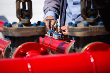 Male worker test ultrasonic flowing fire water hydrant pipes are installed flow rate test devices...