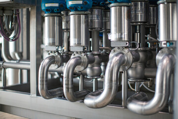 The process pipe valve is stainless at the in-process area of the pipeline flowing stainless food...