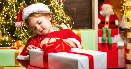 Christmas gift for kids. Happy child with Christmas gift box.