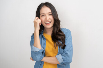 Fototapeta na wymiar Smiling positive, attractive asian young woman wearing casual dress, cheerful portrait of beautiful brunette her with long hair, feeling happy looking at camera standing isolated on white background.