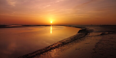 Sonnenaufgang über dem Wattenmeer vor Burhave 