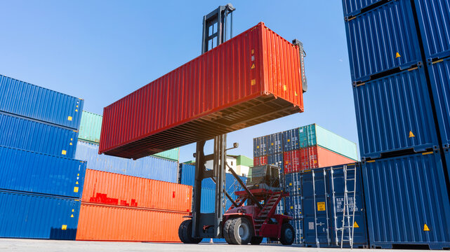 Forklift Working In The Container Cargo Yard Port Loading Cargo Tank  Logistic Service And Transportation Concept.