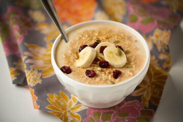 Overnight Pumpkin Spice Oatmeal with bananas, pepitas and dried cranberries