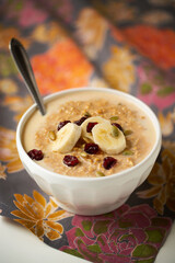 Overnight Pumpkin Spice Oatmeal with bananas, pepitas and dried cranberries