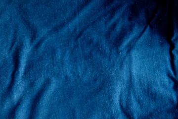 blue fabric background with cotton folds dark canvas texture grunge horizontal