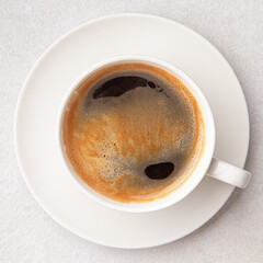 Top view on a cup of black americano coffee on the white background