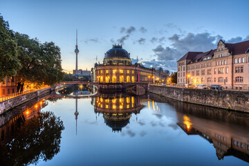 The Bode-Museum and the Television Tower reflected in the river Spree in Berlin before sunrise