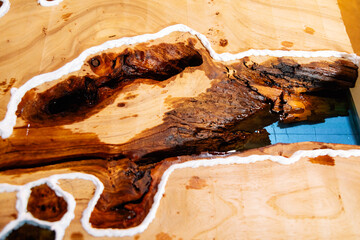 Closeup of dried epoxy resin in wood table