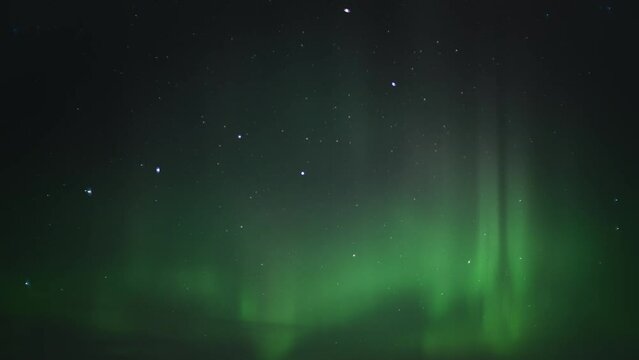 Northern Lights (Aurora Borealis) on the night sky full of stars. Time Lapse. 