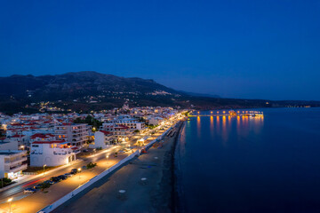 Fototapeta na wymiar Aerial night view of Neapoli, the head town of vatika area, in lakonia, south Peloponnese , Greece.
