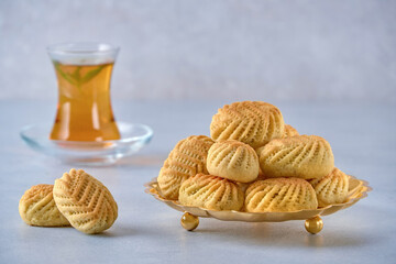 Traditional arabic homemade semolina maamoul or mamoul cookies with dates , walnuts and pistachio...