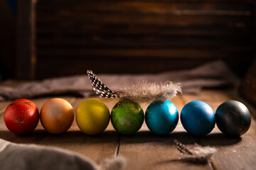 Obraz na płótnie Canvas colorful rainbow Easter eggs on a wooden background