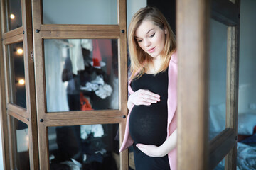 Pregnant young beautiful girl on the ninth month