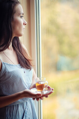 A girl at the window in the house