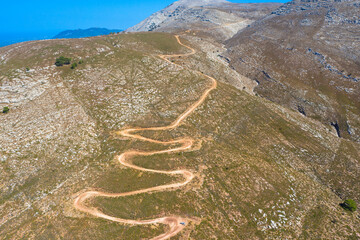 Drone photography from the winding country road to the top of Attavyros Mountain. Rhodes Island, Greece.  - obrazy, fototapety, plakaty