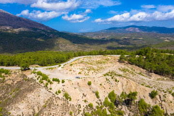 Fototapeta na wymiar Spectacular aerial view to top of Attavyros mountain. Highest mountain in Rhodes island, Greece.