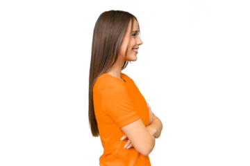 Young pretty caucasian woman over isolated background in lateral position