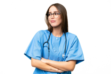 Young nurse caucasian woman over isolated background making doubts gesture while lifting the shoulders