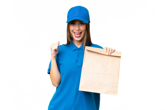 Young beautiful caucasian woman taking a bag of takeaway food over isolated background celebrating a victory in winner position