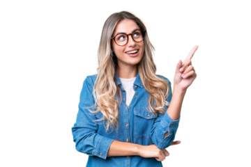 Young Uruguayan woman over isolated background pointing up a great idea