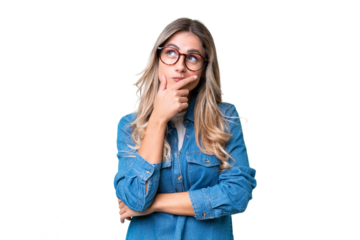 Young Uruguayan woman over isolated background having doubts and with confuse face expression