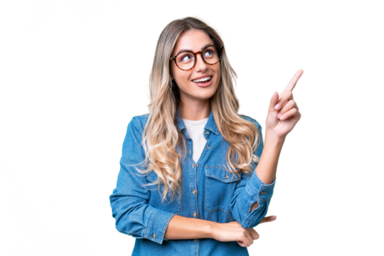 Young Uruguayan woman over isolated background pointing up a great idea