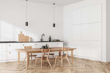 Light kitchen interior with table and seats, cooking and eating corner