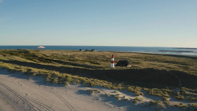 Sylt, Lighthouse Ellenbogen, Northernmost point of Germany. Schleswig-Holstein, North Sea. 4K drone. Beautiful tourist destination and attraction from above.