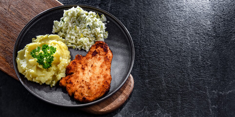 Chicken cutlet coated with breadcrumbs with potatoes and cabbage