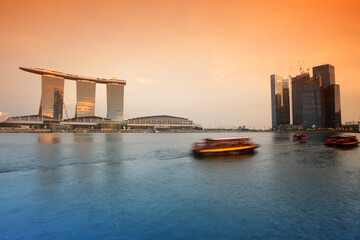 Boat at Marina Bay Sand Hotel and the Artscience Museum at sunset, Singapore