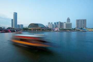 Boat at Marina Bay Sand Hotel and the Artscience Museum at sunset, Singapore