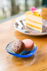 rose and chocolate macaron on plate