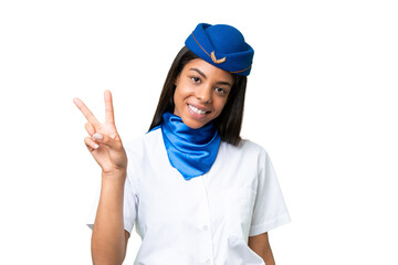 Airplane stewardess African american woman over isolated background smiling and showing victory sign