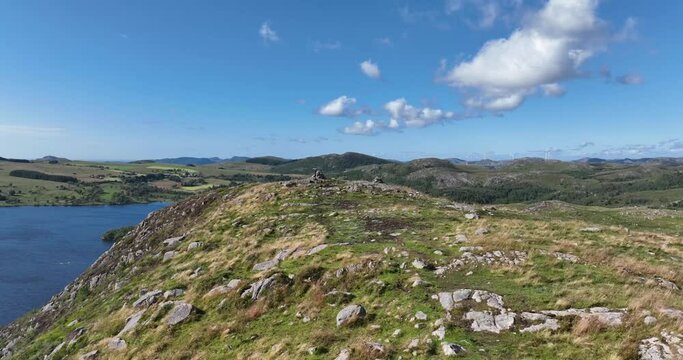 Aerial landscape footage of a lake in a valley in Algard, Norway