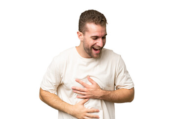 Young handsome caucasian man isolated on green chroma background smiling a lot