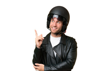 Young caucasian man with a motorcycle helmet isolated on green chroma background pointing up a great idea