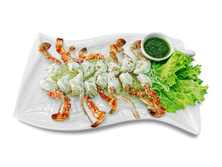 Steamed Crab Legs on White Plate with Green Spicy Seafood Sauce