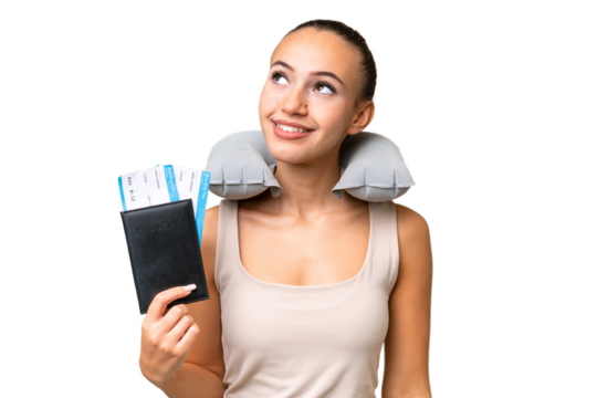 Young Arab woman with Inflatable Travel Pillow over isolated background thinking an idea while looking up