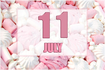 calendar date on the background of white and pink marshmallows. July 11 is the eleventh day of the month