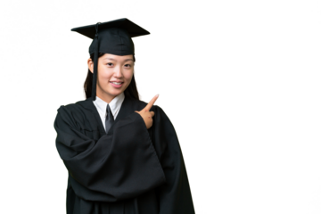 Young university graduate Asian woman over isolated background pointing to the side to present a product