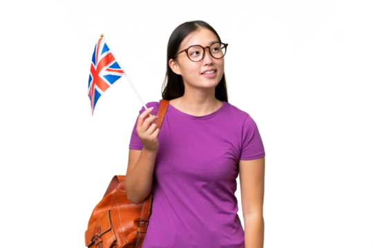 Young Asian woman holding an United Kingdom flag over isolated background thinking an idea while looking up