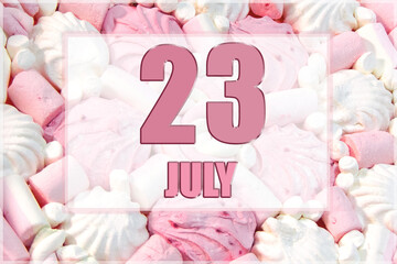 calendar date on the background of white and pink marshmallows. July 23 is the twenty-third day of the month
