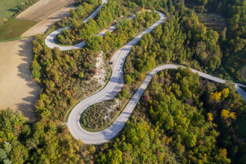 Aerial view of curvy road on Marche region in Italy
