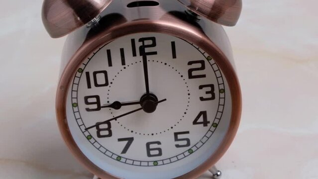 Alarm clock runnig backwards at 9 am. Concept for unemployed , a lie in, or late for work