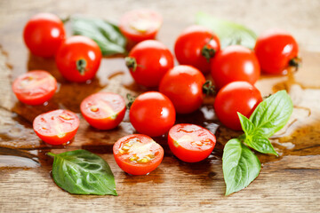 Fresh tomatoes on wooden table.