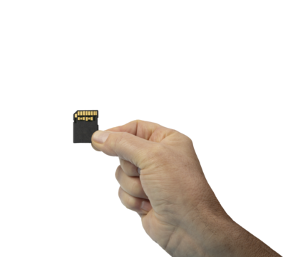 a male hand with a secure digital memory card