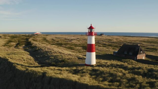 Sylt, Lighthouse Ellenbogen, Northernmost point of Germany. Schleswig-Holstein, North Sea. 4K drone. Beautiful tourist destination and attraction from above.